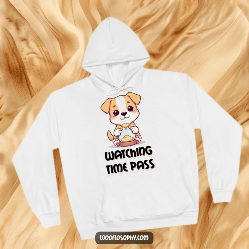 Funny hoodie with a dog character holding a tiny hourglass, captivated by the flowing sand.