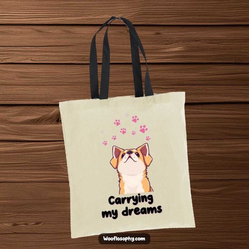 Funny dog tote bag with a dog looking at a paw print constellation, representing dreams and carrying essentials.