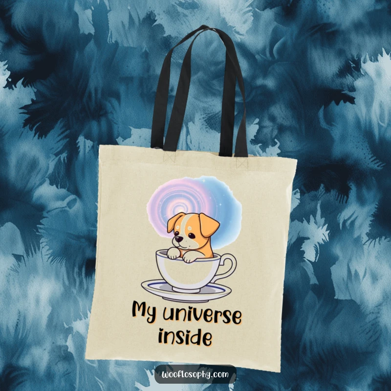 Funny galaxy dog tote bag, a dog thoughtfully looking at a swirling galaxy inside a teacup, for carrying daily items.